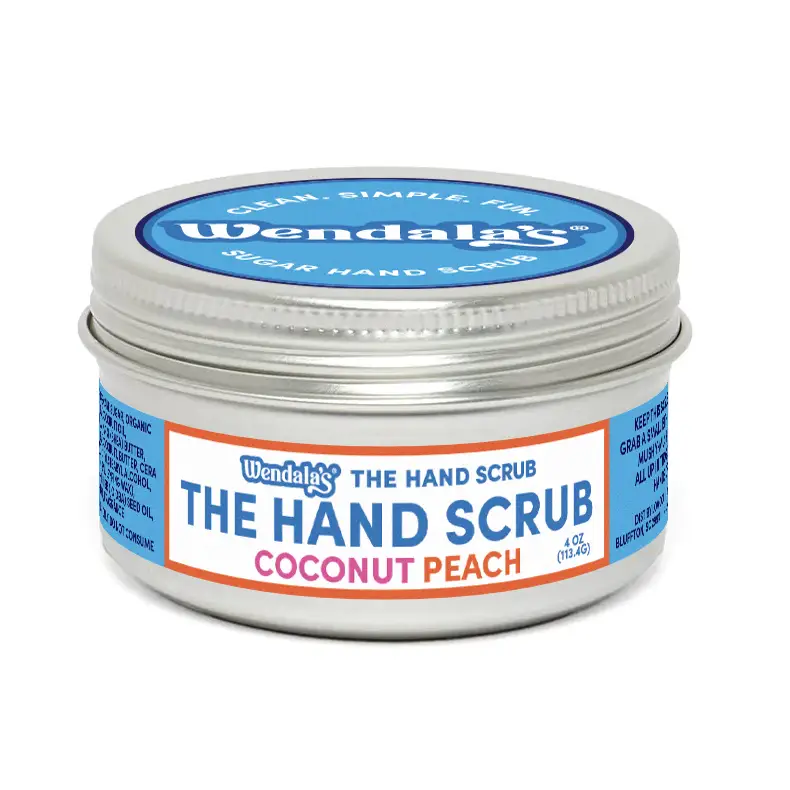 A silver tin of wendalas the hand scrub coconut peach scented with organic coconut for gentle exfoliation