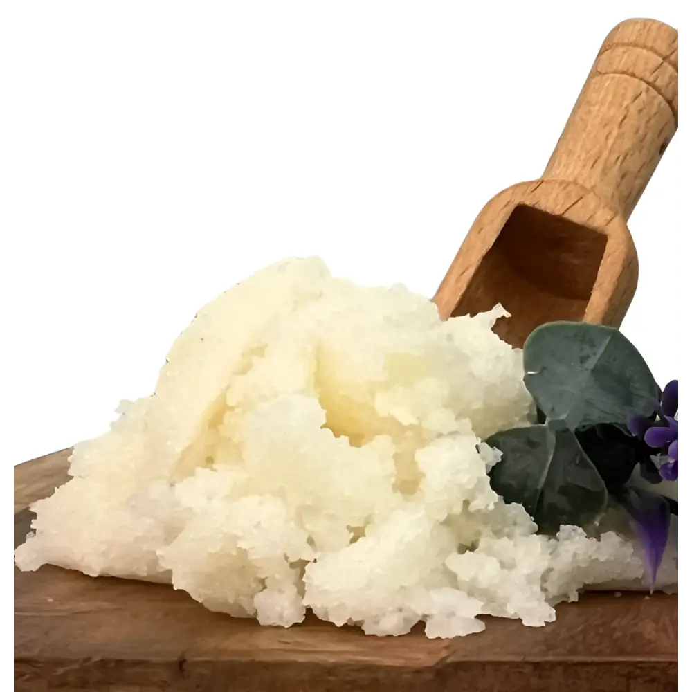 A mound of creamy white hand scrub with eucalyptus lavender scent on a wooden board featuring organic coconut and shea butter