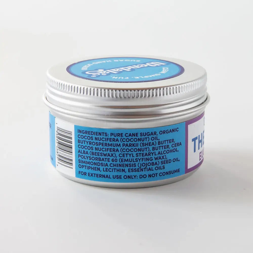 Silver tin container with blue and white label of the body shop hand scrub lavender for exfoliating hands