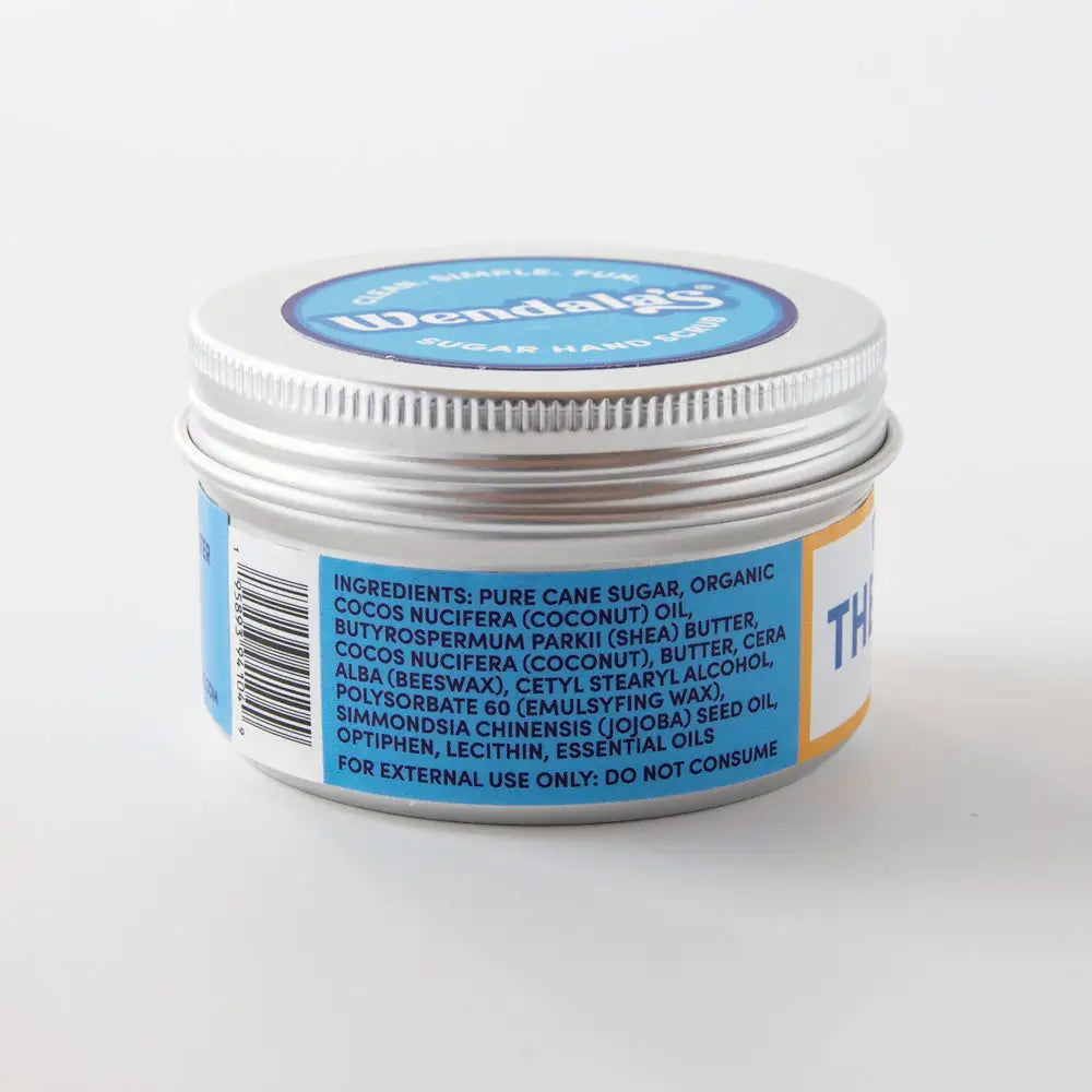 Wendalgy essential oil hand scrub lemon clove in a silver tin with blue and white labeling for hand care