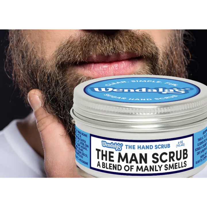 A silver-lidded jar of wendalas the man scrub with shea butter and organic coconut for a blend of manly smells