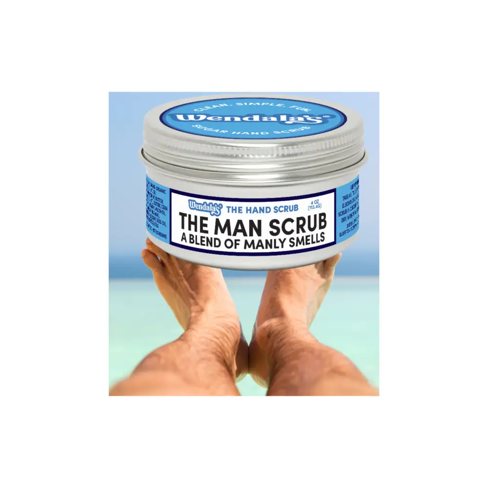 Wendalas the man scrub in a silver tin with blue and white label featuring shea butter and organic coconut ingredients