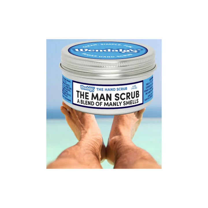 Wendalas the man scrub in a silver tin with blue and white label featuring shea butter and organic coconut ingredients