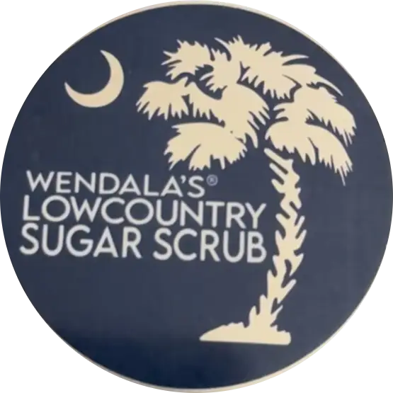 Wendalas man scrub with shea butter and organic coconut features a navy blue label with an off-white palm tree design