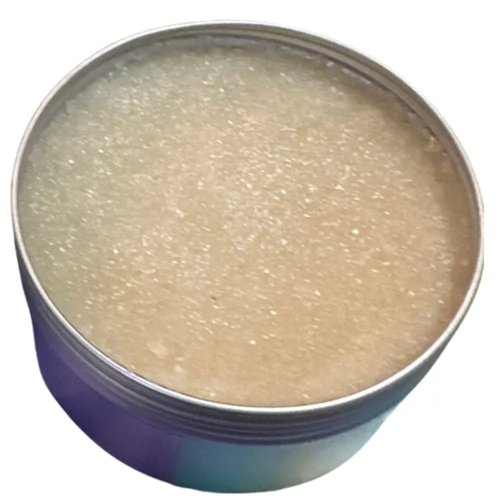 A round metallic tin of wendalas chef scrub containing translucent beige rosemary mint sugar that exfoliates skin