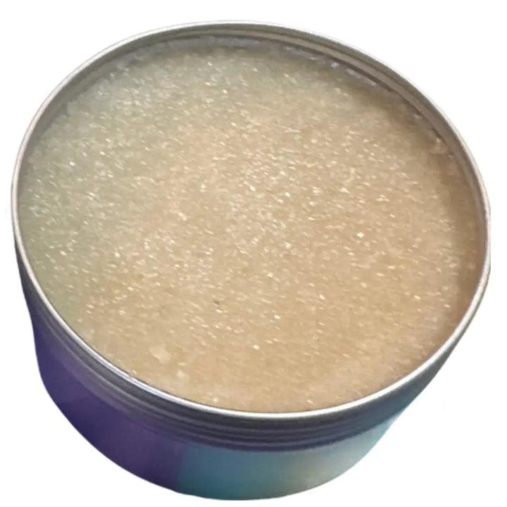 A round metallic tin of wendalas chef scrub containing translucent beige rosemary mint sugar that exfoliates skin