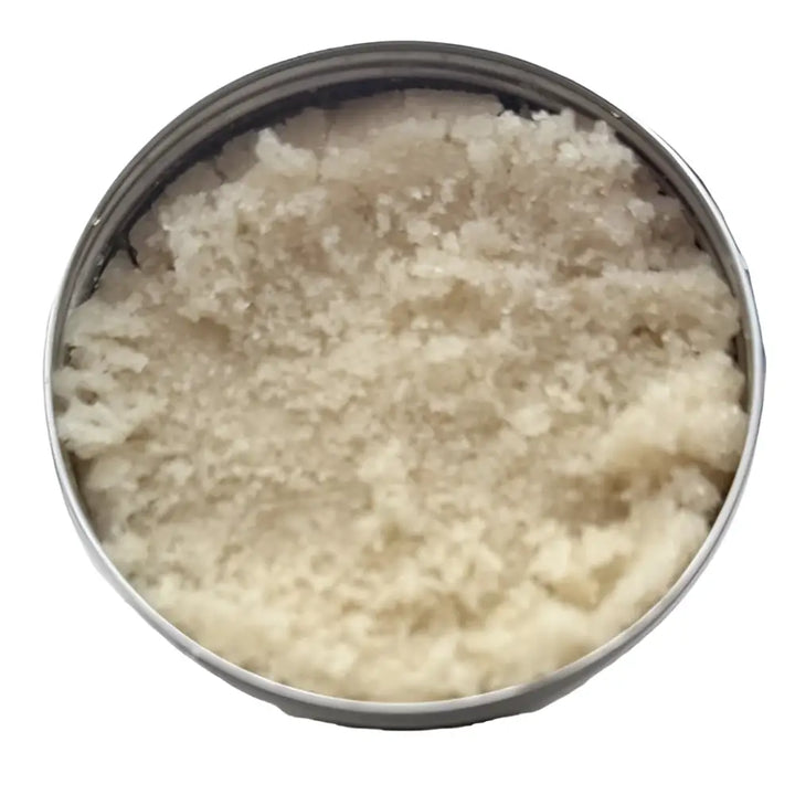 A round metallic can of wendala’s dirtx hand scrub filled with coarse off-white granular hand scrub product