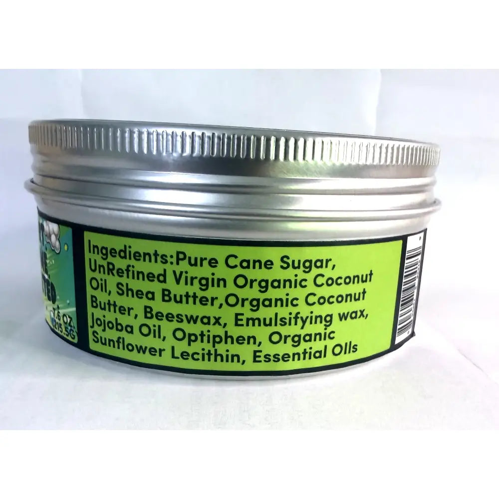 A silver metal jar of Wendalas dirtx hand scrub with a ribbed lid and bright green label listing natural ingredients
