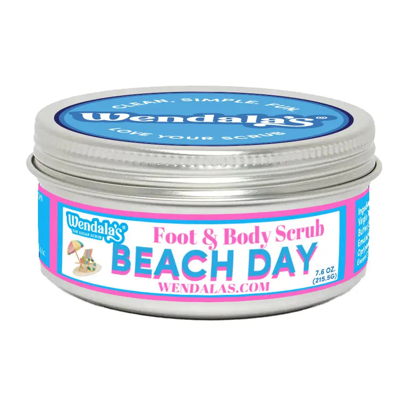 A silver metal jar of Wendala’s foot and body scrub beach day with unrefined shea butter and organic coconut butter label