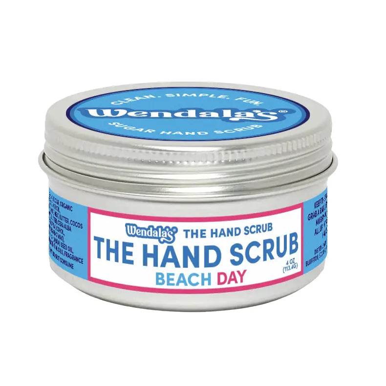 Wendalas beach day hand scrub in a silver tin with blue and pink labeling made with pure cane sugar and organic coconut butter