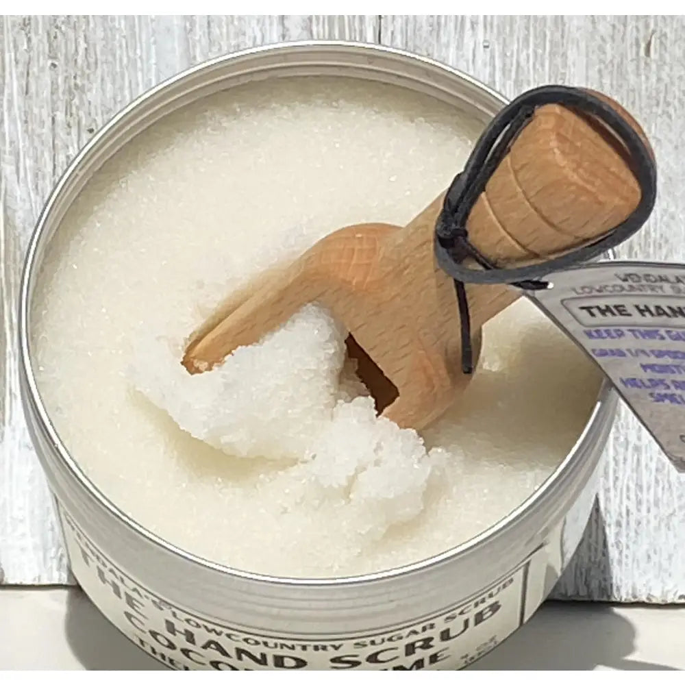Wendalas™ hand scrub coconut lime in a metal tin with wooden scoop featuring organic coconut butter and pure cane sugar