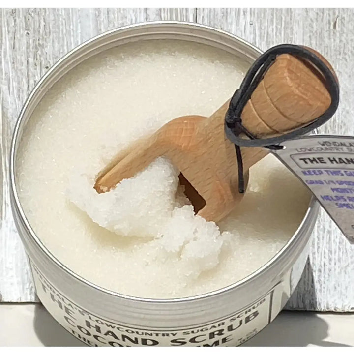 Wendalas™ hand scrub coconut lime in a metal tin with wooden scoop featuring organic coconut butter and pure cane sugar