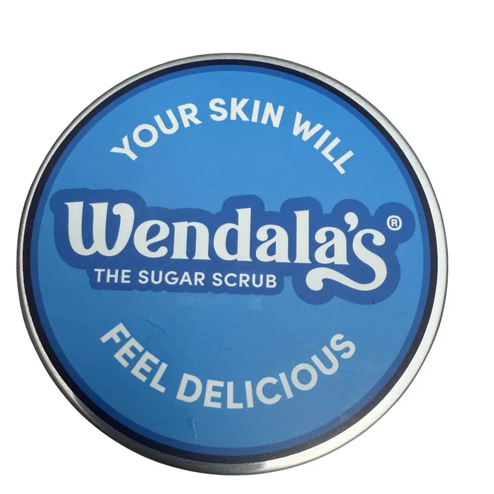 Blue circular tin of Wendalas sugar hand scrub with silver rim and lemon clove scent made with organic coconut
