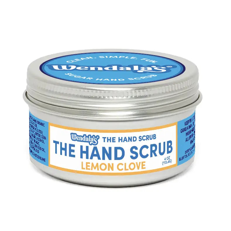 Wendalas lemon clove sugar hand scrub in a silver tin with blue and white labeling featuring organic coconut ingredients