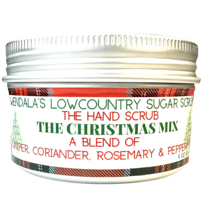 A festive silver-lidded jar of wendalas christmas mix sugar hand scrub with a red and green plaid label