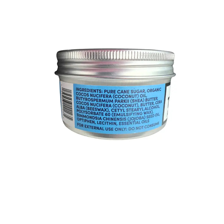 Back side of wendalas man scrub in a silver metal jar with ribbed lid showing ingredients like organic coconut oil and raw sugar