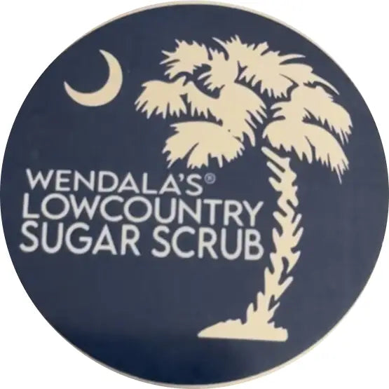 Wendala’s man scrub with a navy blue label featuring an off-white palm tree and crescent moon made with raw sugar and organic coconut oil