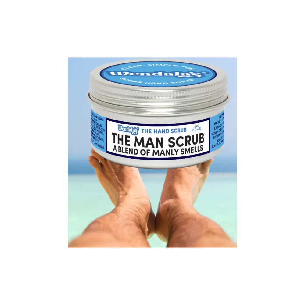 Wendalas man scrub in a silver tin with blue white label featuring organic coconut oil and raw sugar for exfoliation