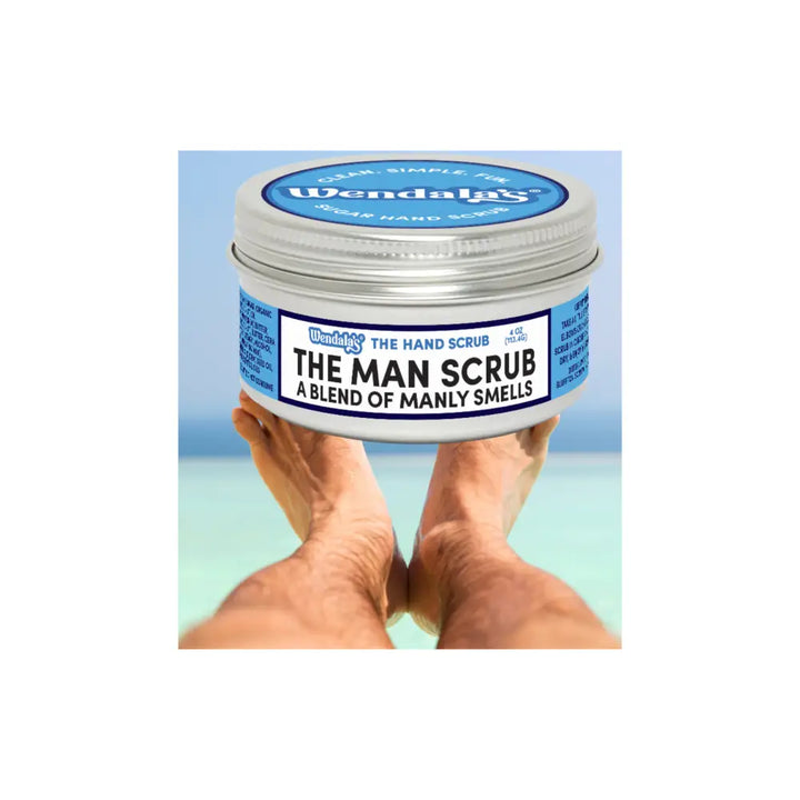 Wendalas man scrub in a silver tin with blue white label featuring organic coconut oil and raw sugar for exfoliation