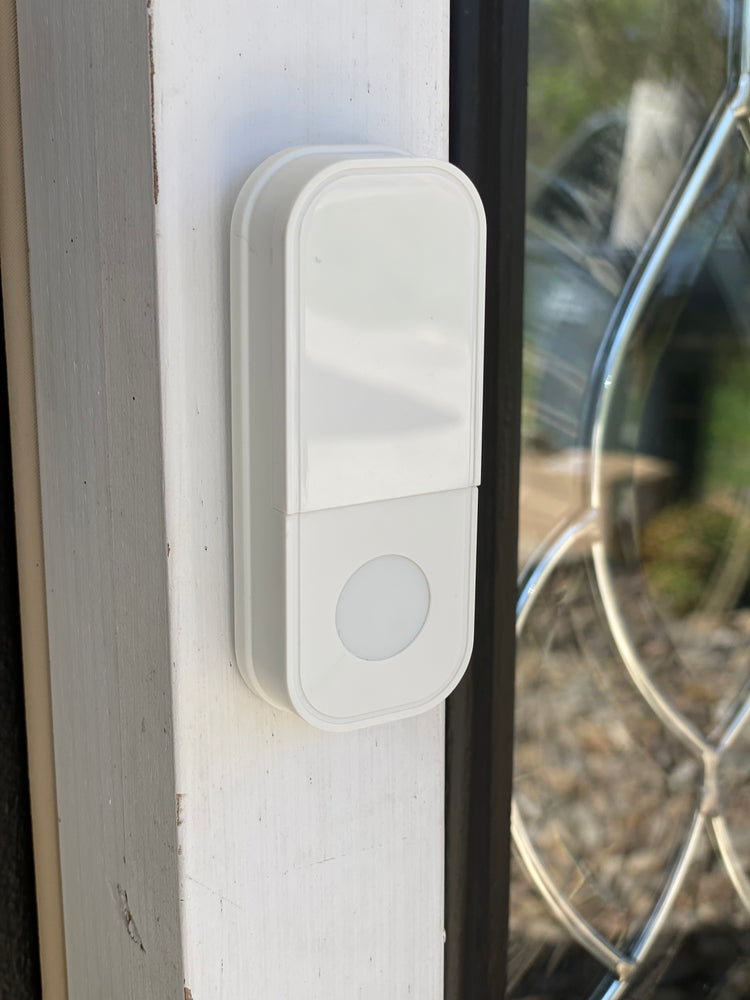 
            
                Load image into Gallery viewer, IQ America WD1040 Wireless Plugin Contemporary Door Chime Door Bell with Pushbutton 2 Melody Notes 100 foot Range Simple Installation and Programming Bring It Anywhere RV Cabin Office! White
            
        